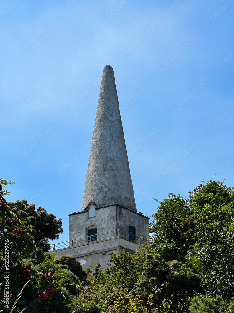 The Obelisk located in Killiney Hill with the view of The Pyramid of Dublin on a sunny day, Ireland