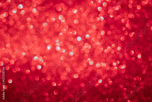background of red glitter in defocusing