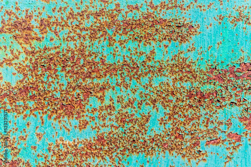 Bright turquoise background. Metal is evenly covered with rust spots. Rusty metal surface with peeling turquoise paint. Topic - metal corrosion and anti-corrosion treatment Bright turquoise background. Metal is evenly covered with rust spots. Rusty metal surface with peeling turquoise paint. Topic - metal corrosion and anti-corrosion treatment