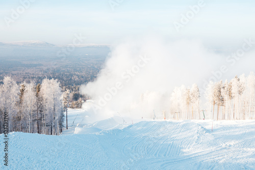 fog on the ski slopes from snow making systems © metelevan