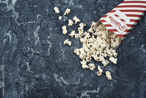 An overturned box of popcorn on the kitchen counter photo