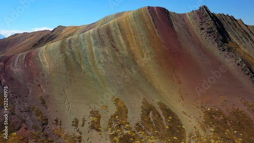 Aerial Forward Scenic Shot Of Rainbow Mountain Range During Winter - Cusco, Peru photo