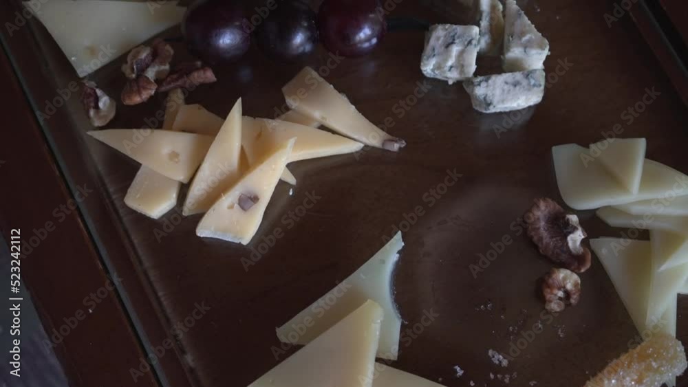 Cheese slices on the board, beautiful restaurant serving. Close-up video. Wiring Cheese slices on the board, beautiful restaurant serving. Close-up video. Wiring