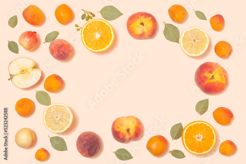 Trendy summer background - tropical fruits on a pink background