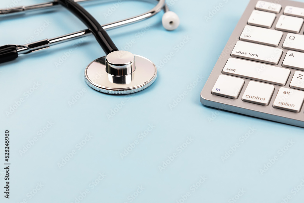 Stethoscope and computer keyboard with copy space Stethoscope and computer keyboard with copy space