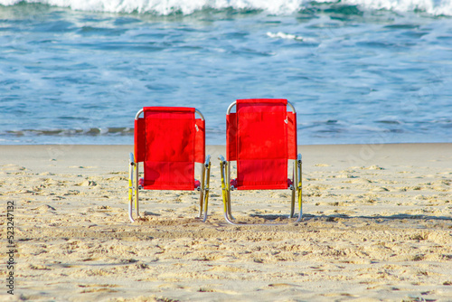 red beach chair at leblon beach in Rio de Janeiro, Brazil. photo