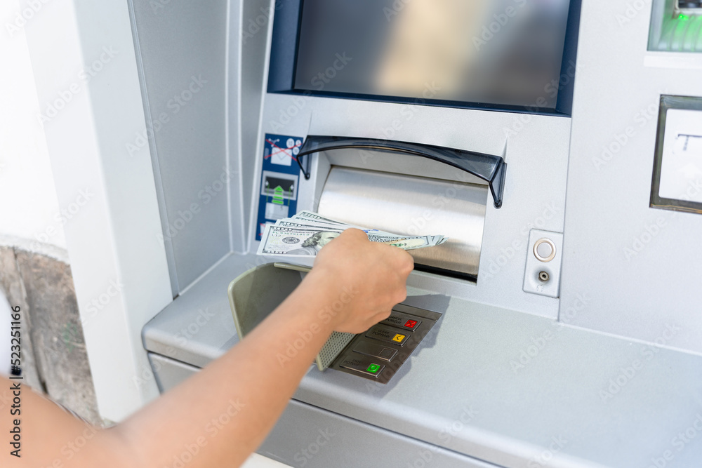Atm money cash machine. Woman withdraw money bill. Holding american hundred dollar cash. Bank credit card, us dollar. Atm money cash machine. Woman withdraw money bill. Holding american hundred dollar cash. Bank credit card, us dollar.