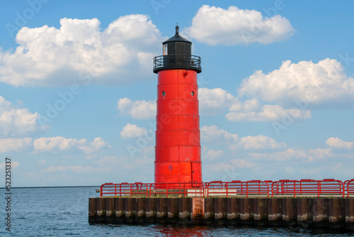 Red Lighthouse on Lake Michigan with blue cloudy sky in Milwaukee, WI