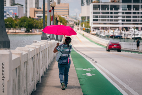 woman walking bridge miami umbrella sun summer  © Alberto GV PHOTOGRAP