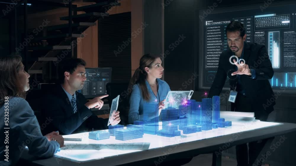 In the Near Future: Businessman presenting concept of 5G Wireless Network Connection to Colleagues and Partners sitting around Futuristic Table with Holographic Modern Augmented Reality Technology.