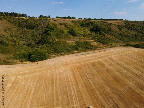 Agricultural Farms and Working Machines at Dunstable Downs England, British Agricultural and Harvesting Fields Farms at Sunset Time. photo