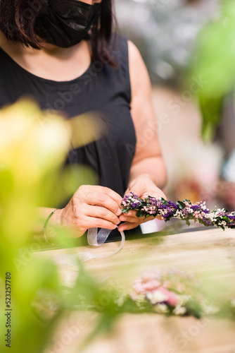 Florist hands detail arrangement flowers decoration. woman owner business plant shop worker