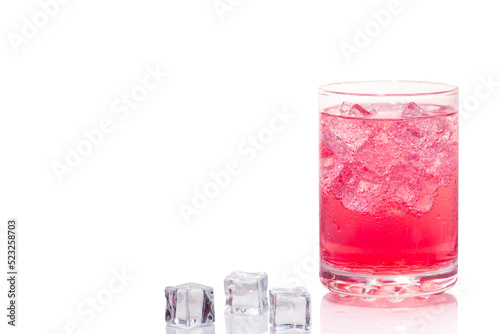 A glass of pinky-red soft drink and ice tube isolated on white background.