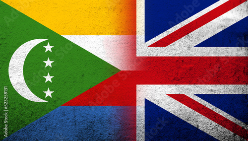 National flag of United Kingdom (Great Britain) Union Jack with The Union of the Comoros National flag. Grunge background