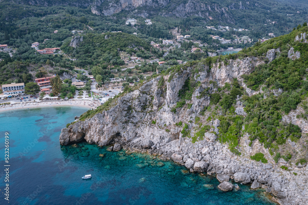 Agios Spyridonas beach an rocky shore in Palaiokastritsa village, Corfu Island, Greece