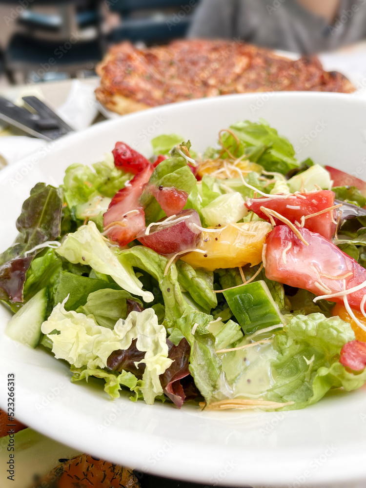 Salad with strawberries mango and grapes at a restaurant Salad with strawberries mango and grapes at a restaurant