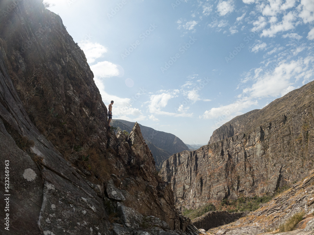 Fototapeta premium hiker in view from the top of the mountain