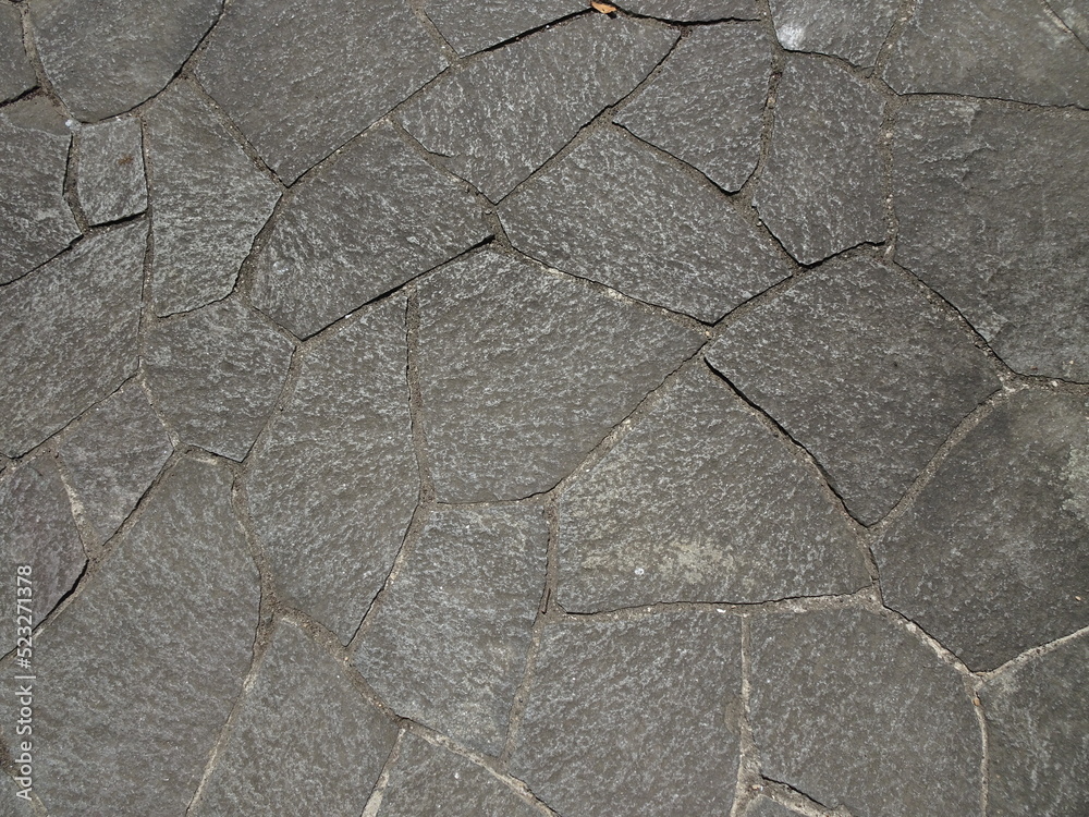 Obraz premium 幾何学模様に敷き詰められた灰色のタイルのテクスチャー