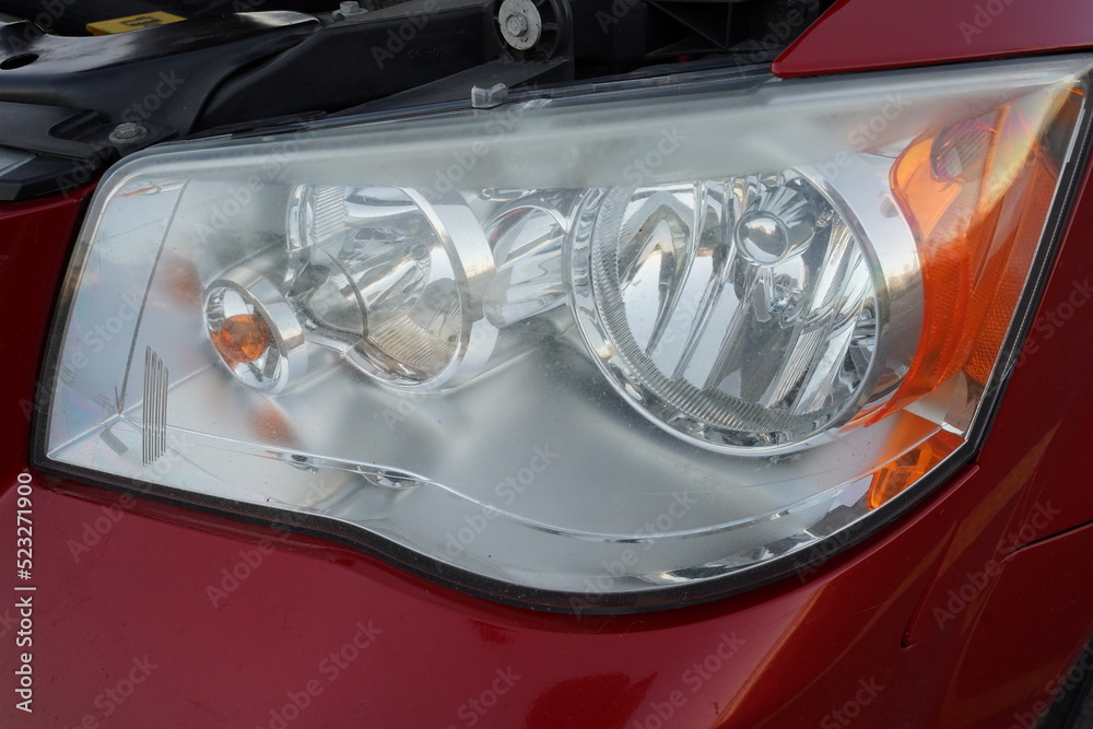 Headlights on red 2013 van. Headlights on red 2013 van.