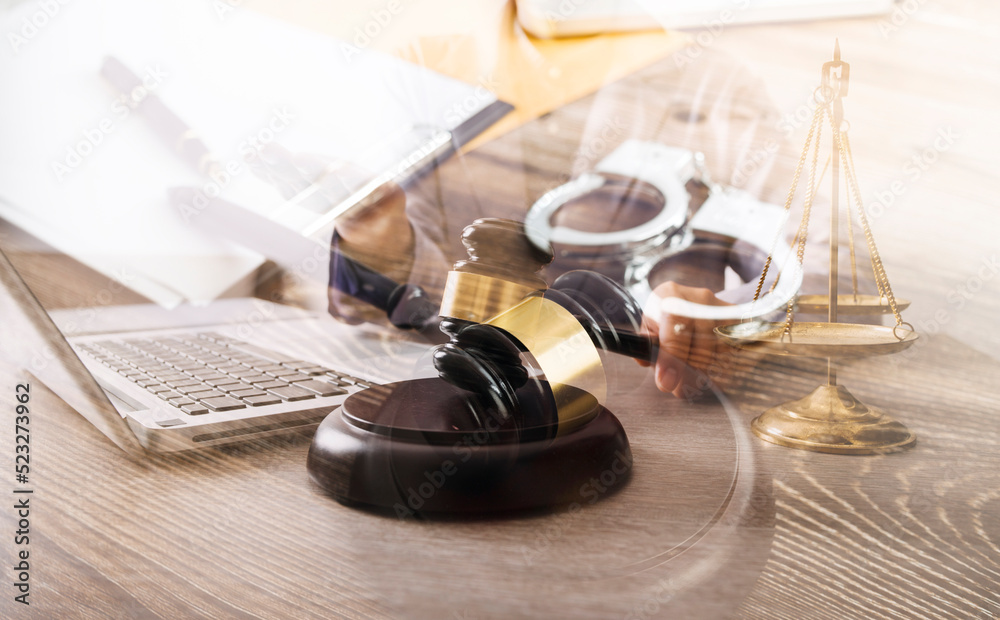 Male lawyer working with contract papers and wooden gavel on tabel in courtroom. justice and law ,attorney, court judge, concept. Male lawyer working with contract papers and wooden gavel on tabel in courtroom. justice and law ,attorney, court judge, concept.