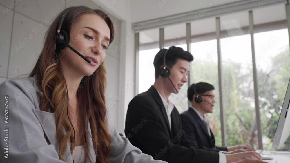Busines man and woman callcenter team office working with laptop and earphone telesale and call center helpline concept Busines man and woman callcenter team office working with laptop and earphone telesale and call center helpline concept