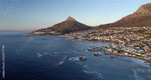 Aerial Beautiful Shot Of Residential Town On Mountains, Drone Flying Backwards Over Sea - Cape Town, South Africa