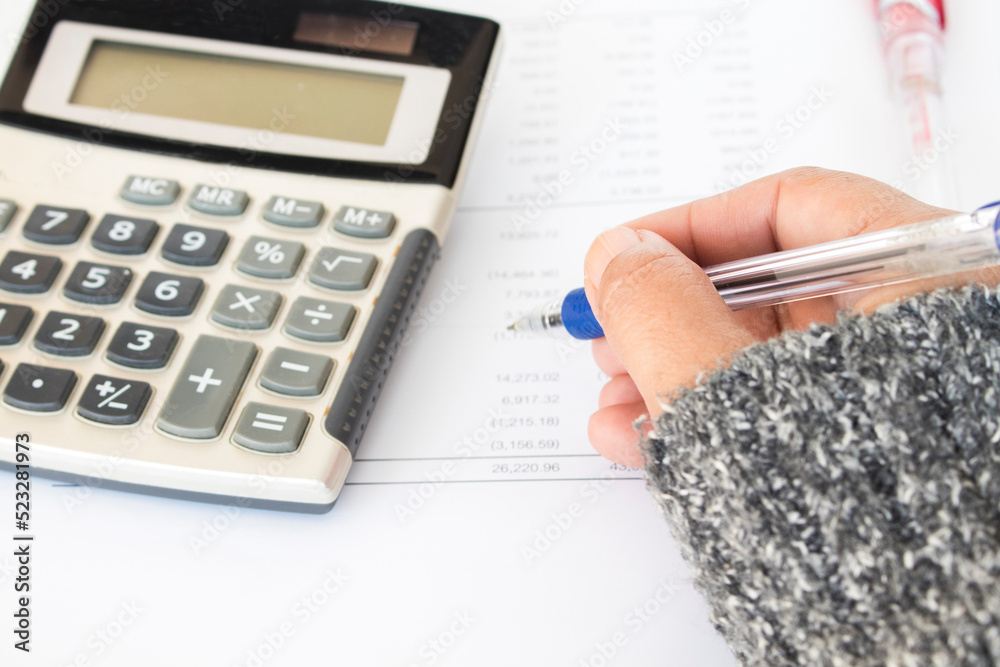 woman working checkin financial statement for business work of personal arrangement flat lay style at office desk woman working checkin financial statement for business work of personal arrangement flat lay style at office desk