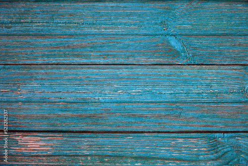 Texture of Old cracked aquamarine or celadon boards for background and design. The texture of dry wood planks