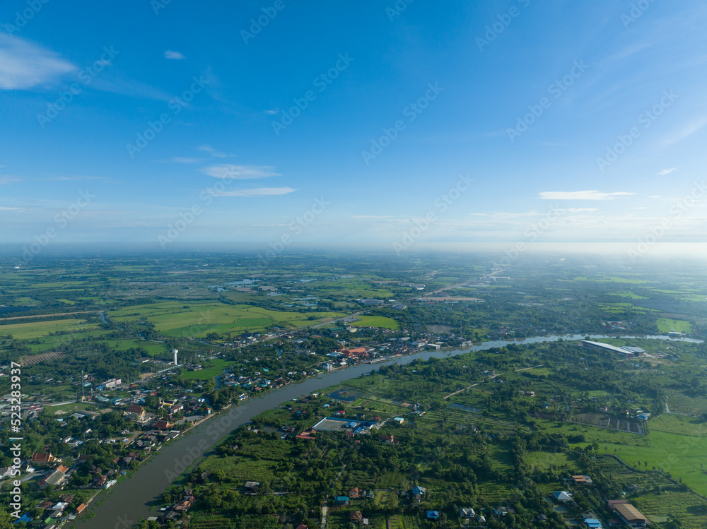 flying with bluesky day time with approching mist in horizon and river curve on bottom