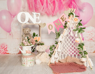 pink and white decoration for a 1st birthday cake smash studio photo shoot with balloons, paper decor, cake and topper. High quality photo