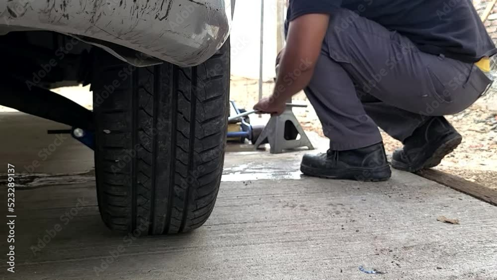 mechanic changing car wheel mechanic changing car wheel