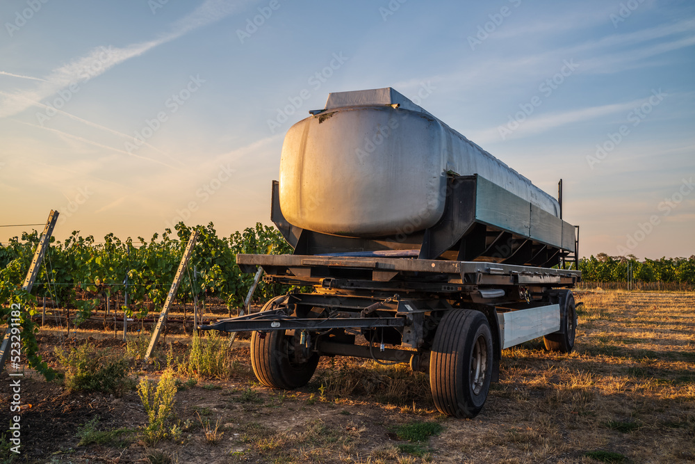 Obraz premium water trailer in a vineyard