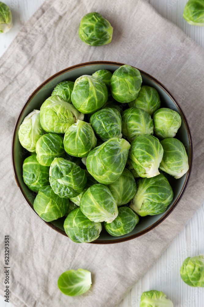 Raw Organic Brussel Sprouts in a Bowl, top view. Flat lay, overhead, from above. Raw Organic Brussel Sprouts in a Bowl, top view. Flat lay, overhead, from above.