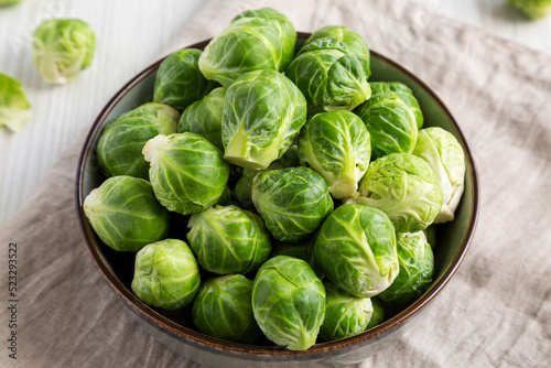 Raw Organic Brussel Sprouts in a Bowl, side view. Close-up.