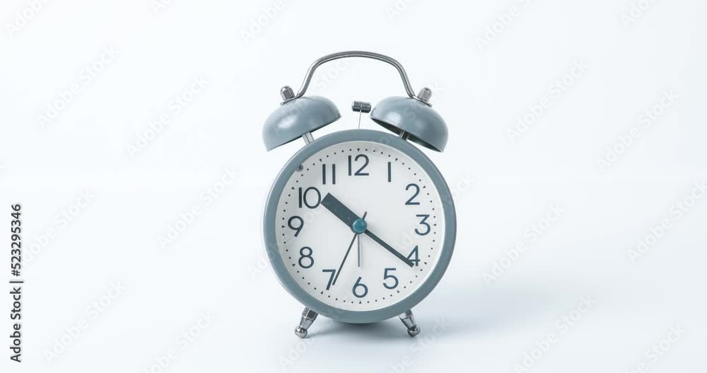 time lapse scene of retro ring Alarm clock on white background , time management concept time lapse scene of retro ring Alarm clock on white background , time management concept