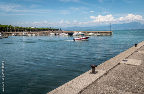 Peschiera del Garda town. little town harbour with colorful boats. Italian Garda lake, Veneto region of northern Italy, Europe - august 8, 2022