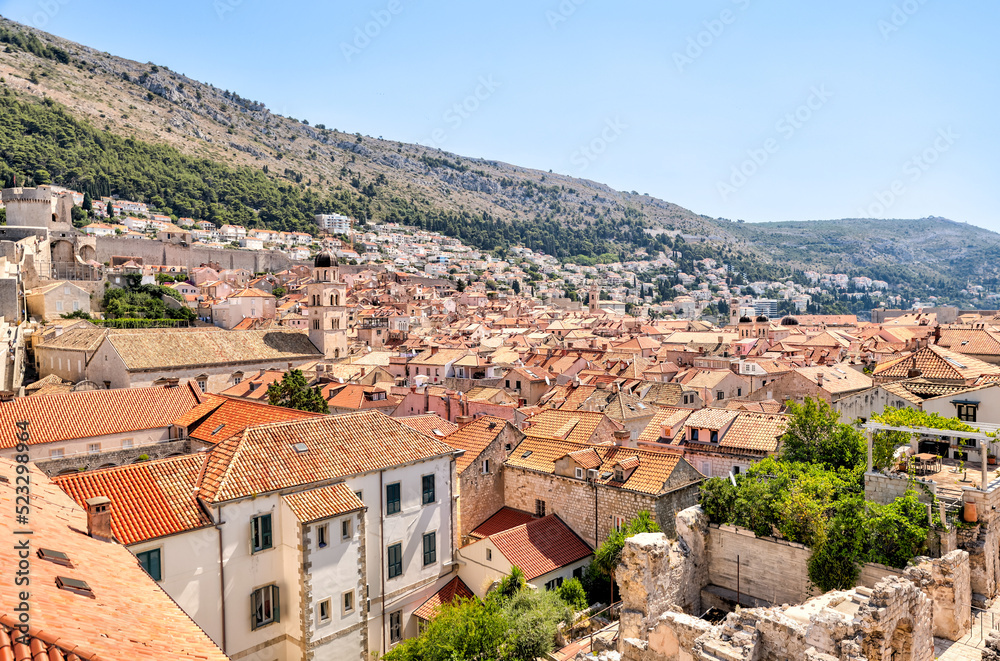 Medieval architecture in the walled city and the rugged coastline of Dubrovnik, Croatia with views of the Adriatic Sea