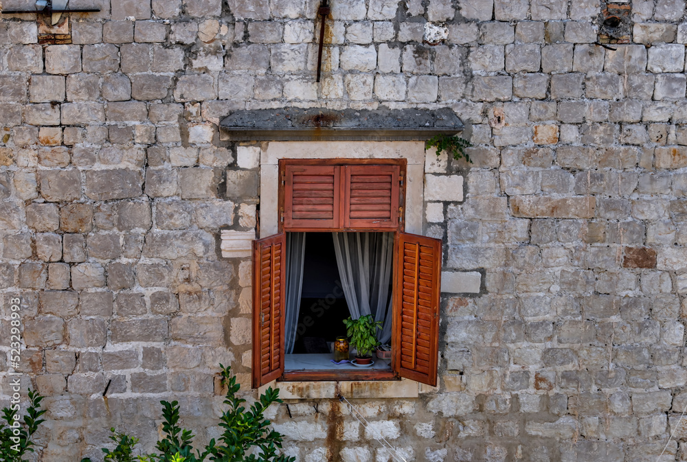 Medieval architecture in the walled city and the rugged coastline of Dubrovnik, Croatia with views of the Adriatic Sea Medieval architecture in the walled city and the rugged coastline of Dubrovnik, Croatia with views of the Adriatic Sea