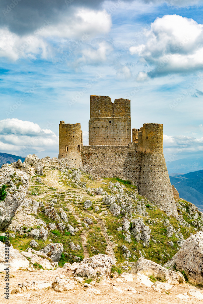 The Castle of Rocca Calascio is a mountain top fortress  in the Province of L'Aquila, Abruzzo, central Italy, Europe. Gran Sasso e Monti della Laga National Park. Tourist sightseeing. Vertical image.