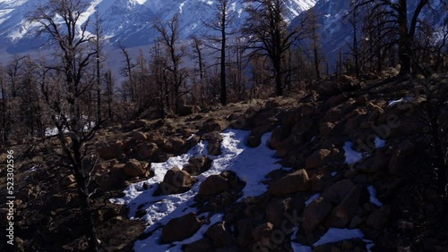Aerial drone footage of a mountain range in Mammoth Lakes, California during daytime. Natural alpine landscape with rugged peaks and open terrain.