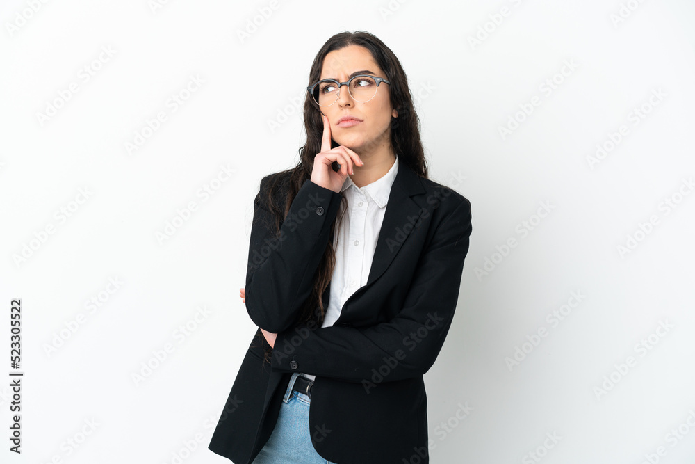 Young business woman isolated on white background having doubts while looking up Young business woman isolated on white background having doubts while looking up