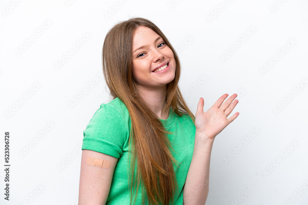 Young caucasian woman wearing a band aids isolated on white background saluting with hand with happy expression Young caucasian woman wearing a band aids isolated on white background saluting with hand with happy expression