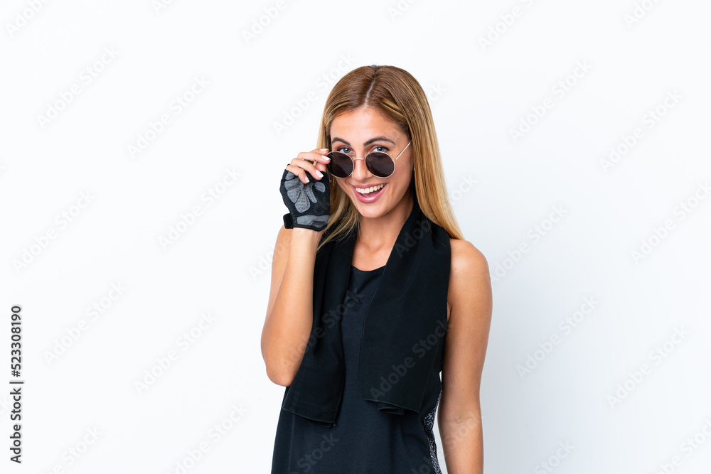 Blonde Uruguayan sport girl isolated on white background with glasses and surprised Blonde Uruguayan sport girl isolated on white background with glasses and surprised