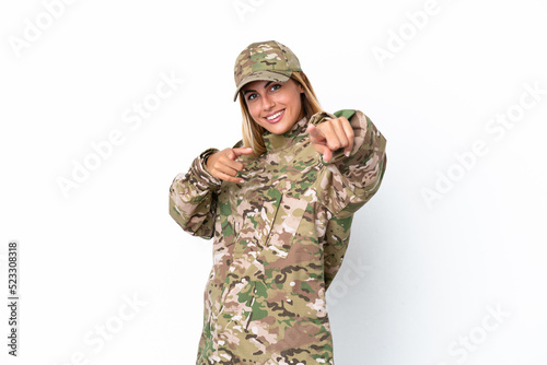 Military woman isolated on white background pointing to the front and smiling