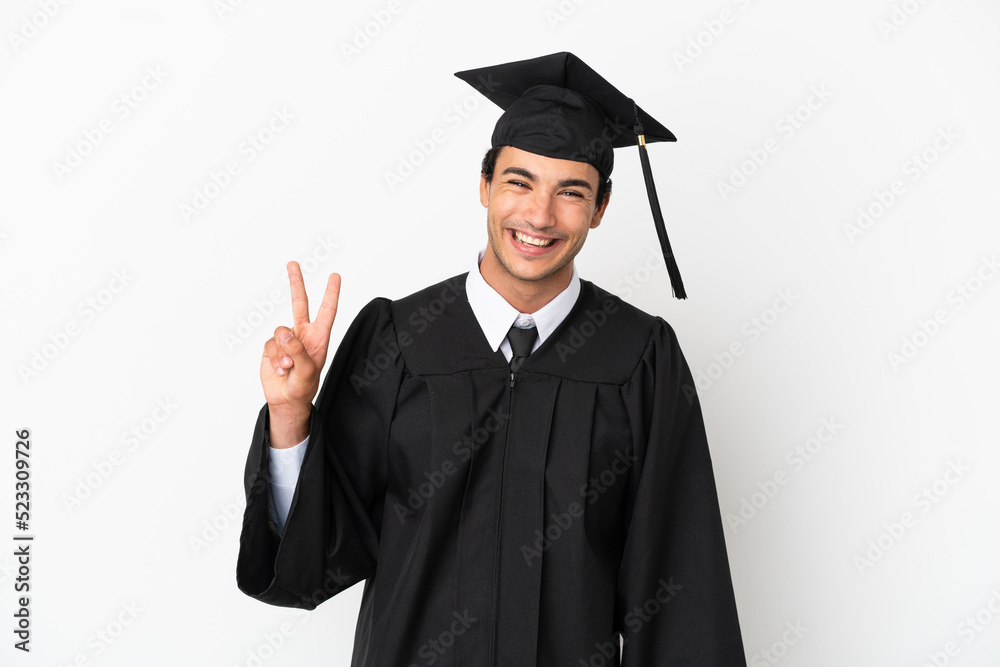 Young university graduate over isolated white background smiling and showing victory sign Young university graduate over isolated white background smiling and showing victory sign