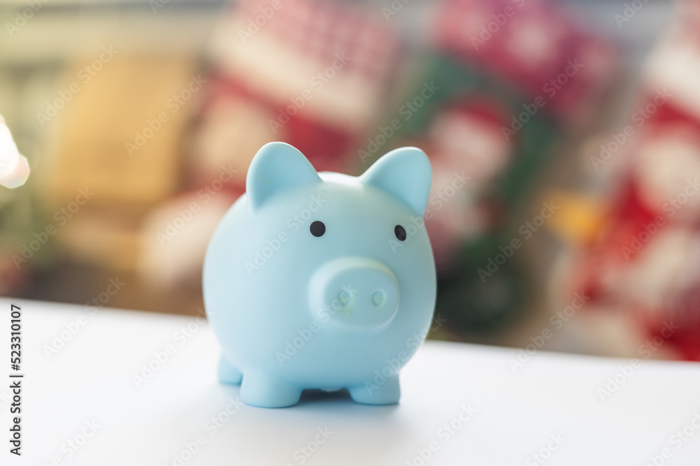 Piggy bank and christmas interior with xmas tree Piggy bank and christmas interior with xmas tree