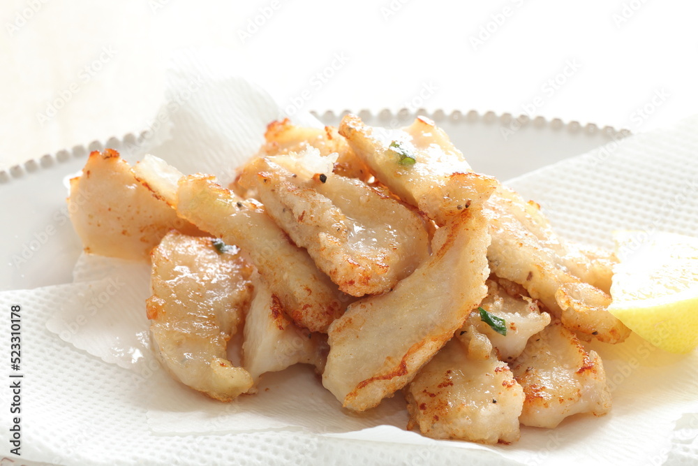 Chinese food, deep fried chicken soft bone served with Lemon