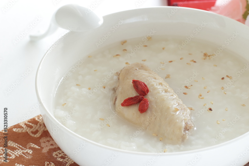 Chinese food, chicken wings and dried wolf berries in rice porridge Chinese food, chicken wings and dried wolf berries in rice porridge