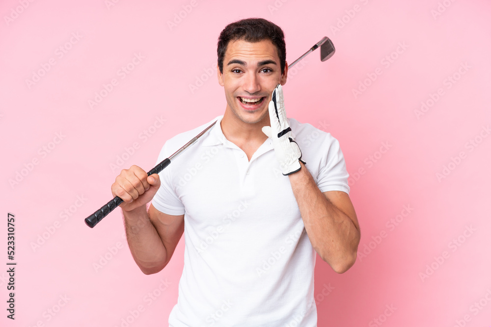 Young golfer player man isolated on pink background with surprise and shocked facial expression Young golfer player man isolated on pink background with surprise and shocked facial expression
