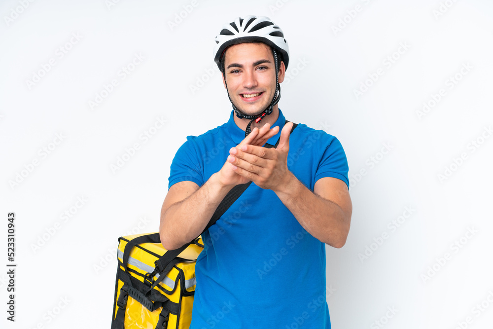 Young caucasian man with thermal backpack isolated on white background applauding after presentation in a conference Young caucasian man with thermal backpack isolated on white background applauding after presentation in a conference